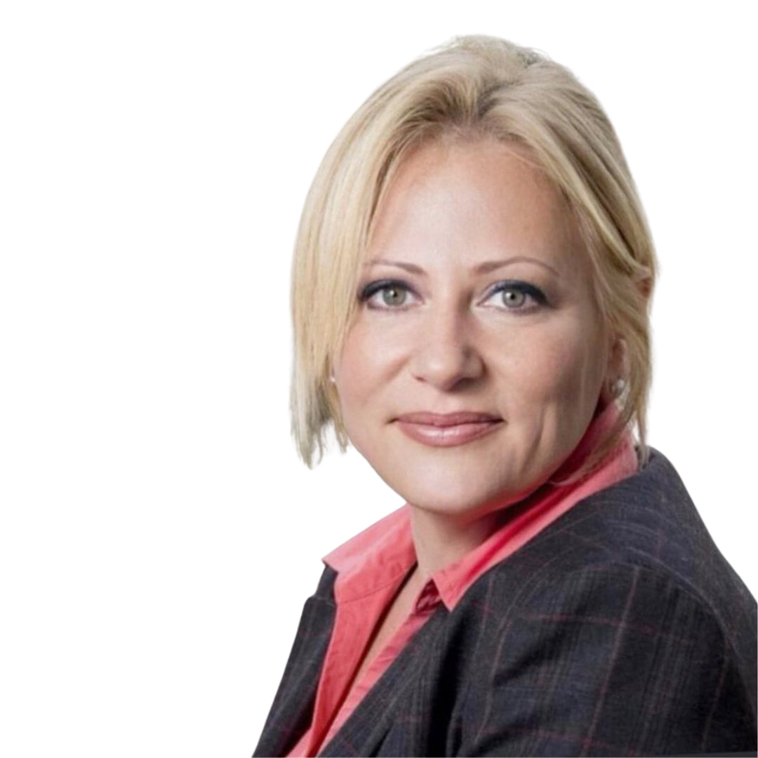 Professional headshot of Dr. Veronica Stahl in a pink blouse and grey blazer, exuding confidence and expertise.